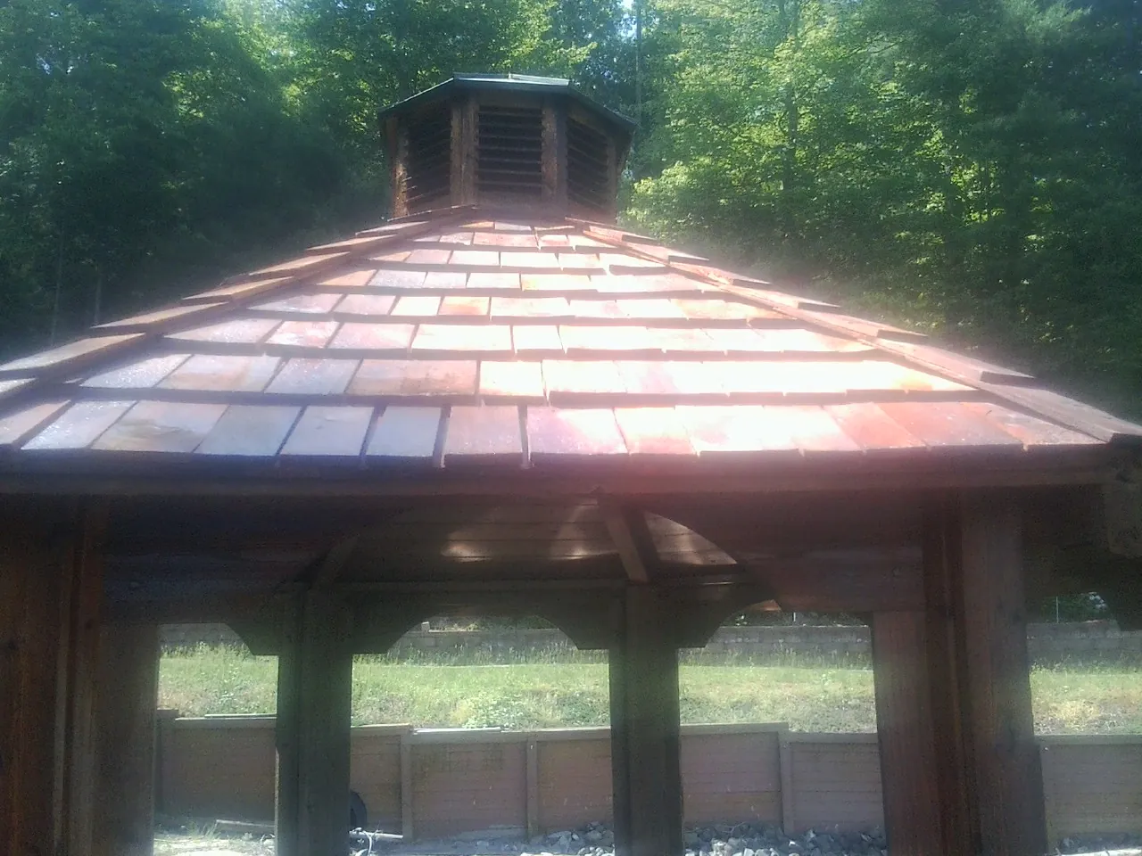 New cedar shake roof and cupola on a lakeside gazebo in Cropseyville
